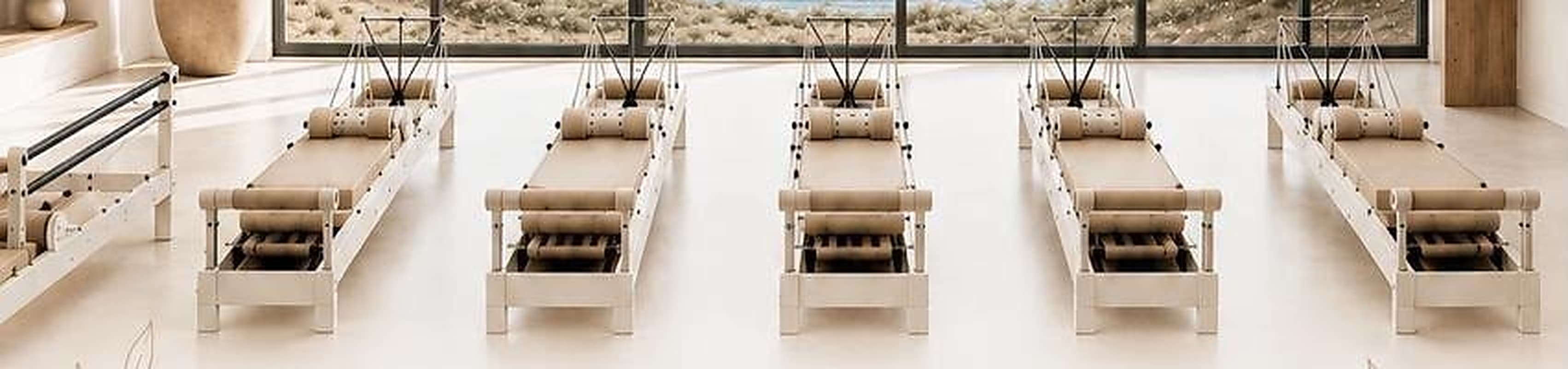 White reformers lined toward the ocean-view windows